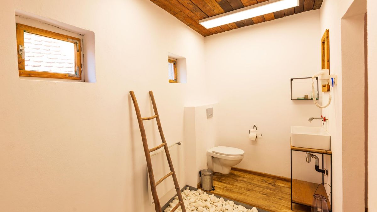 Bathroom with a ladder towel rail