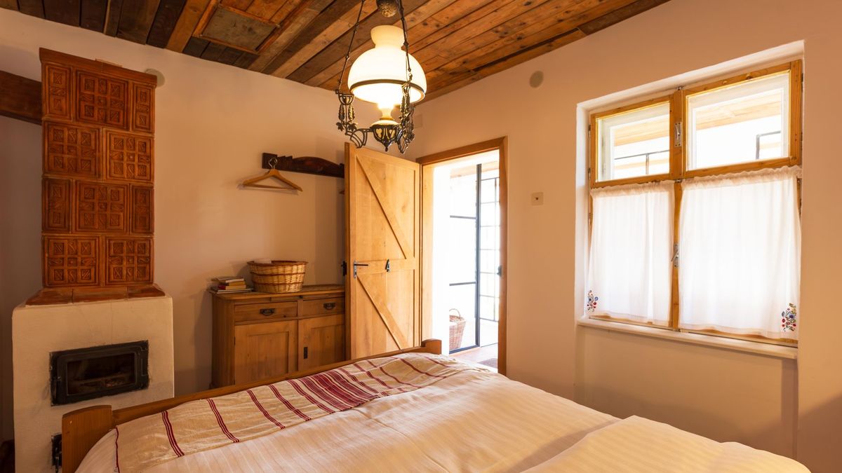 Unglazed terracotta stove and the bed